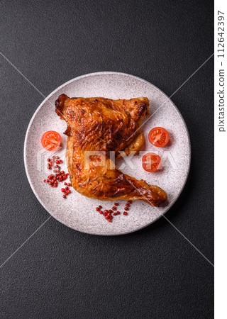 Delicious grilled chicken leg or quarter with salt and spices Delicious grilled chicken leg or quarter with salt and spices 112642397