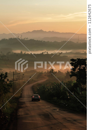 Cars on the road. 112642675