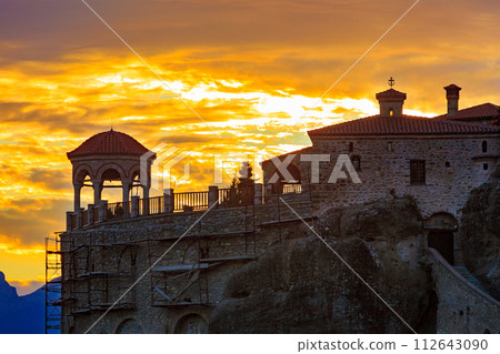 Sunset over Varlaam monastery in Meteora, Greece 112643090