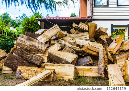 Stack of firewood at house Stack of firewood at house 112643159