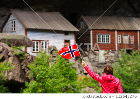 Tourist visiting Helleren houses in Jossingfjord, Norway 112643270