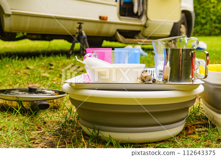 Clean dishes drying on fresh air, camping outdoor 112643375