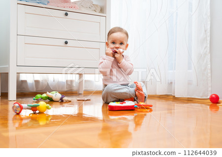A bright room in which the baby plays with toys A bright room in which the baby plays with toys 112644039