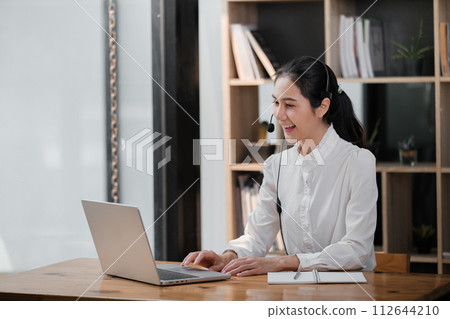 Happy call center woman consulting customer for customer support, help or telemarketing sales. Sales advisor, CRM girl with smile for success customer service, contact us hotline or insurance deal 112644210