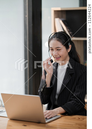 Happy call center woman consulting customer for customer support, help or telemarketing sales. Sales advisor, CRM girl with smile for success customer service, contact us hotline or insurance deal 112644224