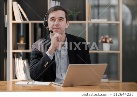 Handsome well dressed businessman working at his office, businessman working on a project 112644225