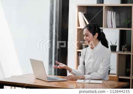 Happy call center woman consulting customer for customer support, help or telemarketing sales. Sales advisor, CRM girl with smile for success customer service, contact us hotline or insurance deal 112644235