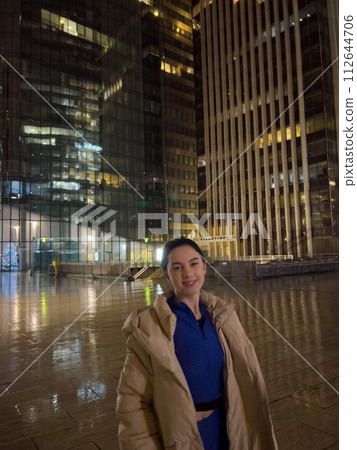 Beautiful young woman tourist in Paris at night. Paris is the capital and most populous city of France. Beautiful young woman tourist in Paris at night. Paris is the capital and most populous city of France. 112644706