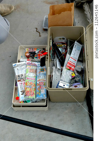 Catch white-tailed squirrel and black-tailed fish on the quay of the fishing port Catch white-tailed squirrel and black-tailed fish on the quay of the fishing port 112645146