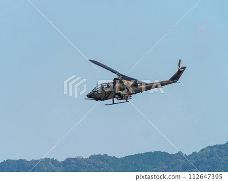 JGSDF anti-tank helicopter AH-1S Cobra flying over Yao Garrison 112647395