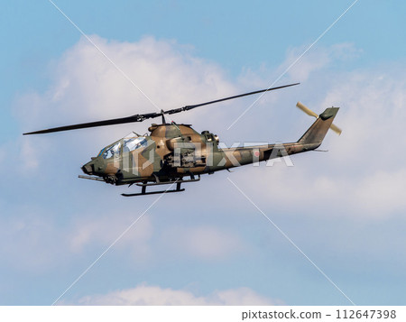 JGSDF anti-tank helicopter AH-1S Cobra flying over Yao Garrison 112647398