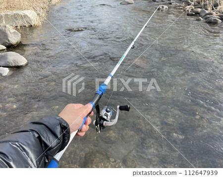 Mountain stream fishing 112647939