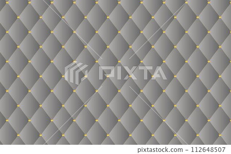 gray quilted fabric background with golden crown clasp 112648507