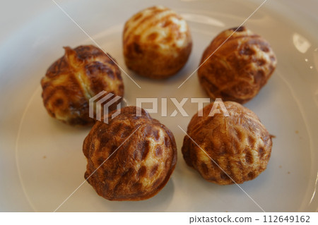 Walnut cakes are a popular snack in Korea. It is a type of pastry bread baked with wheat flour dough and walnuts and red bean paste inside. Walnut cakes are a popular snack in Korea. It is a type of pastry bread baked with wheat flour dough and walnuts and red bean paste inside. 112649162