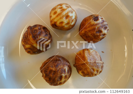 Walnut cakes are a popular snack in Korea. It is a type of pastry bread baked with wheat flour dough and walnuts and red bean paste inside. Walnut cakes are a popular snack in Korea. It is a type of pastry bread baked with wheat flour dough and walnuts and red bean paste inside. 112649163