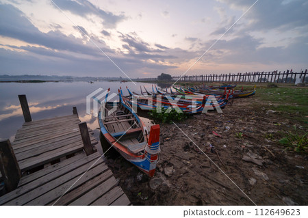 U Bein Bridge with lake, Wooden Bridge in Mon village, Myanmar or Burma, Asia. U Bein Bridge with lake, Wooden Bridge in Mon village, Myanmar or Burma, Asia. 112649623