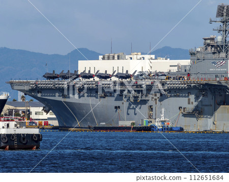 US Navy amphibious assault ship America anchored in Nanko Minami, Osaka 112651684
