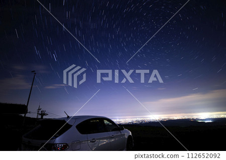 Car light trails and star trails 112652092