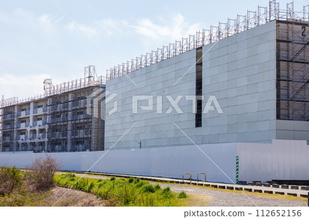 Two dilapidated apartment buildings undergoing demolition work Two dilapidated apartment buildings undergoing demolition work 112652156