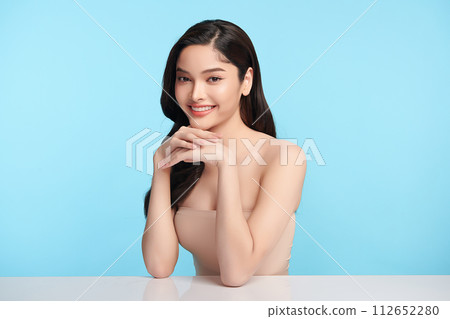 Beautiful young asian woman with clean fresh skin on blue background, Face care, Facial treatment, Cosmetology, beauty and spa, Asian women portrait. Beautiful young asian woman with clean fresh skin on blue background, Face care, Facial treatment, Cosmetology, beauty and spa, Asian women portrait. 112652280