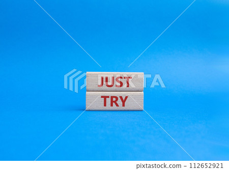 Just try symbol. Concept words Just try on wooden blocks. Beautiful blue background. Business and Just Try concept. Copy space. Just try symbol. Concept words Just try on wooden blocks. Beautiful blue background. Business and Just Try concept. Copy space. 112652921