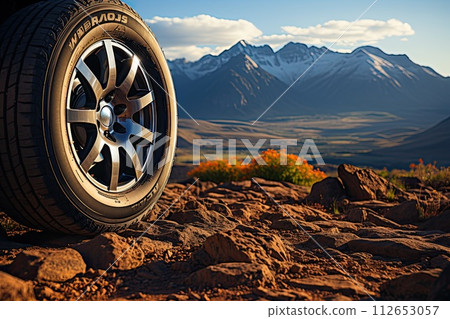 Off road treaded car wheel on top of mountain with beautiful scenery, Ai Off road treaded car wheel on top of mountain with beautiful scenery, Ai 112653057