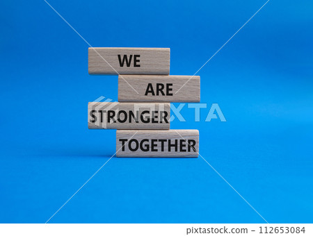 We are stronger together symbol. Wooden blocks with words We are stronger together. Beautiful blue background. We are stronger together concept. Copy space. We are stronger together symbol. Wooden blocks with words We are stronger together. Beautiful blue background. We are stronger together concept. Copy space. 112653084
