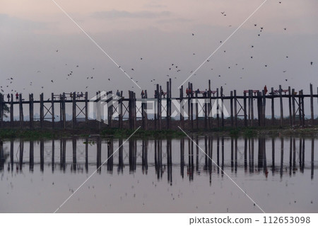 U Bein Bridge with lake, Wooden Bridge in Mon village, Myanmar or Burma, Asia. 112653098