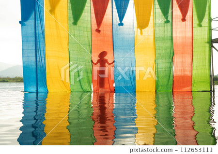 Colorful fabric in Inle, Myanmar. Clothes material for design decoration background. Handcraft 112653111