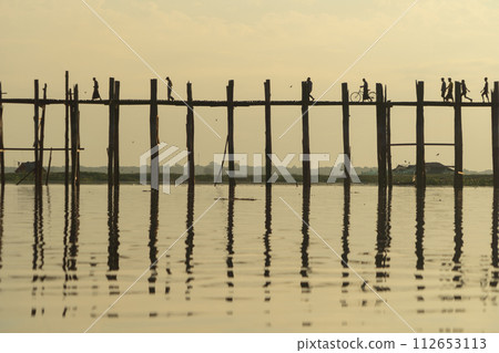 U Bein Bridge with lake, Wooden Bridge in Mon village, Myanmar or Burma, Asia. U Bein Bridge with lake, Wooden Bridge in Mon village, Myanmar or Burma, Asia. 112653113