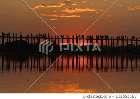 U Bein Bridge with lake, Wooden Bridge in Mon village, Myanmar or Burma, Asia. U Bein Bridge with lake, Wooden Bridge in Mon village, Myanmar or Burma, Asia. 112653163