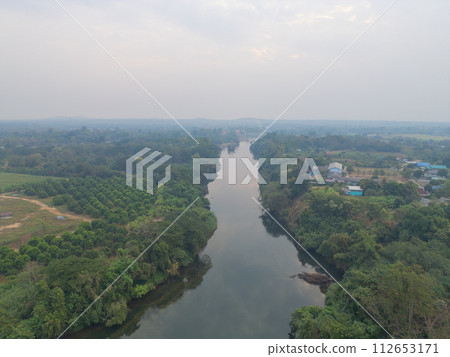 Aerial top view of lush green trees from above in tropical forest in national park in summer season. Natural landscape. Pattern texture background. 112653171