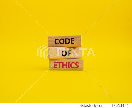 Code of ethics symbol. Concept words Code of ethics on wooden blocks. Beautiful yellow background. Business and Code of ethics concept. Copy space. Code of ethics symbol. Concept words Code of ethics on wooden blocks. Beautiful yellow background. Business and Code of ethics concept. Copy space. 112653455