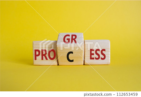 Process and Progress symbol. Wooden cubes with words Process and Progress. Beautiful yellow background. Business and Process and Progress concept. Copy space Process and Progress symbol. Wooden cubes with words Process and Progress. Beautiful yellow background. Business and Process and Progress concept. Copy space 112653459