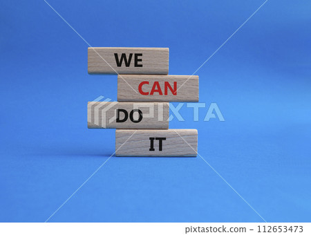 We can do it symbol. Concept words We can do it on wooden blocks. Beautiful blue background. Business and We can do it concept. Copy space. 112653473