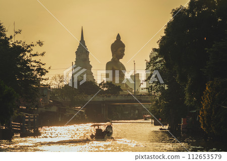The Giant Golden Buddha in Wat Paknam Phasi Charoen Temple in Phasi Charoen district, Bangkok urban city, Thailand. The Giant Golden Buddha in Wat Paknam Phasi Charoen Temple in Phasi Charoen district, Bangkok urban city, Thailand. 112653579