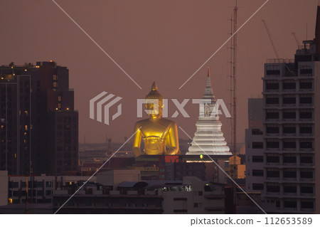 The Giant Golden Buddha in Wat Paknam Phasi Charoen Temple in Phasi Charoen district, Bangkok urban city, Thailand. 112653589