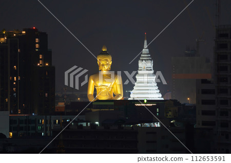 The Giant Golden Buddha in Wat Paknam Phasi Charoen Temple in Phasi Charoen district, Bangkok urban city, Thailand. The Giant Golden Buddha in Wat Paknam Phasi Charoen Temple in Phasi Charoen district, Bangkok urban city, Thailand. 112653591