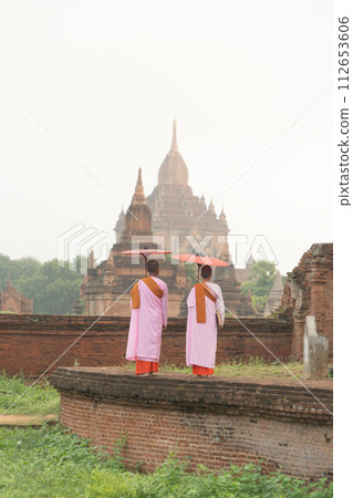 A monk in Burmese temples of Bagan City, Myanmar or Burma. People lifestyle. A monk in Burmese temples of Bagan City, Myanmar or Burma. People lifestyle. 112653606