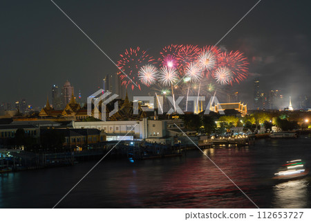 Fireworks with golden pagoda at Temple of the Emerald Buddha in Bangkok, Thailand. Wat Phra Kaew and Grand palace in old town, urban city. Buddhist temple, Thai architecture. A tourist attraction Fireworks with golden pagoda at Temple of the Emerald Buddha in Bangkok, Thailand. Wat Phra Kaew and Grand palace in old town, urban city. Buddhist temple, Thai architecture. A tourist attraction 112653727