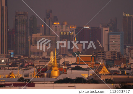 Golden pagoda at Temple of the Emerald Buddha in Bangkok, Thailand. Wat Phra Kaew and Grand palace in old town, urban city. Buddhist temple, Thai architecture. A tourist attraction. Golden pagoda at Temple of the Emerald Buddha in Bangkok, Thailand. Wat Phra Kaew and Grand palace in old town, urban city. Buddhist temple, Thai architecture. A tourist attraction. 112653737