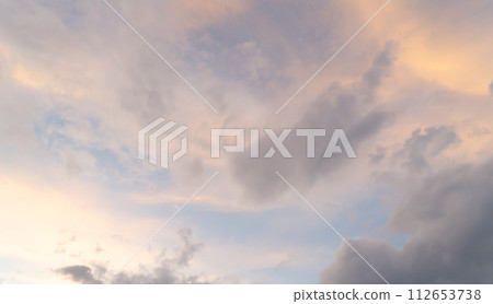Sunset sky. Abstract nature background. Dramatic blue with orange colorful clouds in twilight time. 112653738