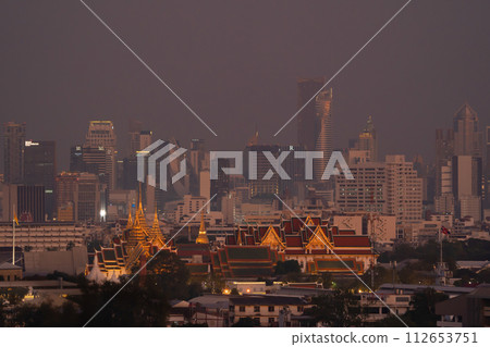 Golden pagoda at Temple of the Emerald Buddha in Bangkok, Thailand. Wat Phra Kaew and Grand palace in old town, urban city. Buddhist temple, Thai architecture. A tourist attraction. 112653751
