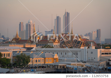 Golden pagoda at Temple of the Emerald Buddha in Bangkok, Thailand. Wat Phra Kaew and Grand palace in old town, urban city. Buddhist temple, Thai architecture. A tourist attraction. 112653758