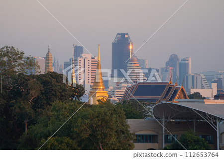 Golden pagoda at Temple of the Emerald Buddha in Bangkok, Thailand. Wat Phra Kaew and Grand palace in old town, urban city. Buddhist temple, Thai architecture. A tourist attraction. 112653764