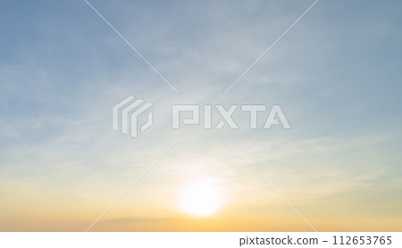 Sunset sky. Abstract nature background. Dramatic blue with orange colorful clouds in twilight time. 112653765