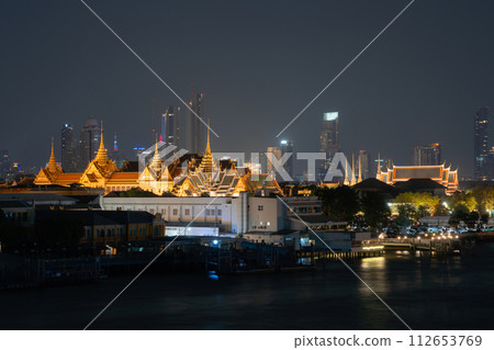 Golden pagoda at Temple of the Emerald Buddha in Bangkok, Thailand. Wat Phra Kaew and Grand palace in old town, urban city. Buddhist temple, Thai architecture. A tourist attraction. 112653769