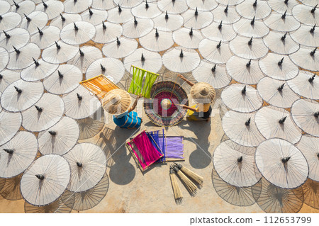 Myanmar people making white umbrellas. Decoration. Lifestyle Myanmar people making white umbrellas. Decoration. Lifestyle 112653799