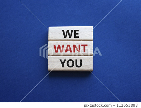 We want you symbol. Concept words We want you on wooden blocks. Beautiful deep blue background. Business and We want you concept. Copy space. 112653898