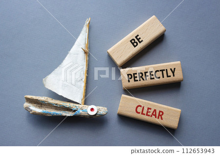 Be perfectly clear symbol. Concept words Be perfectly clear on wooden blocks. Beautiful grey background with boat. Business and Be perfectly clear concept. Copy space 112653943